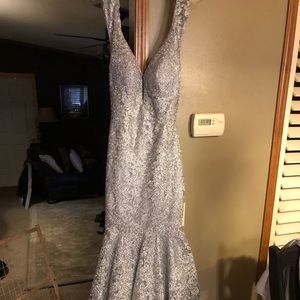 Silver colored prom dress.